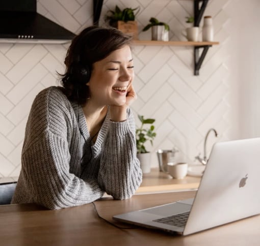 woman video calling on laptop